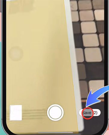 an iPhone screen showing a picture of a document clicked and a save icon in notes app